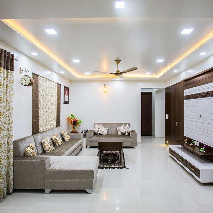 Bright living room with sectional seating and television unit